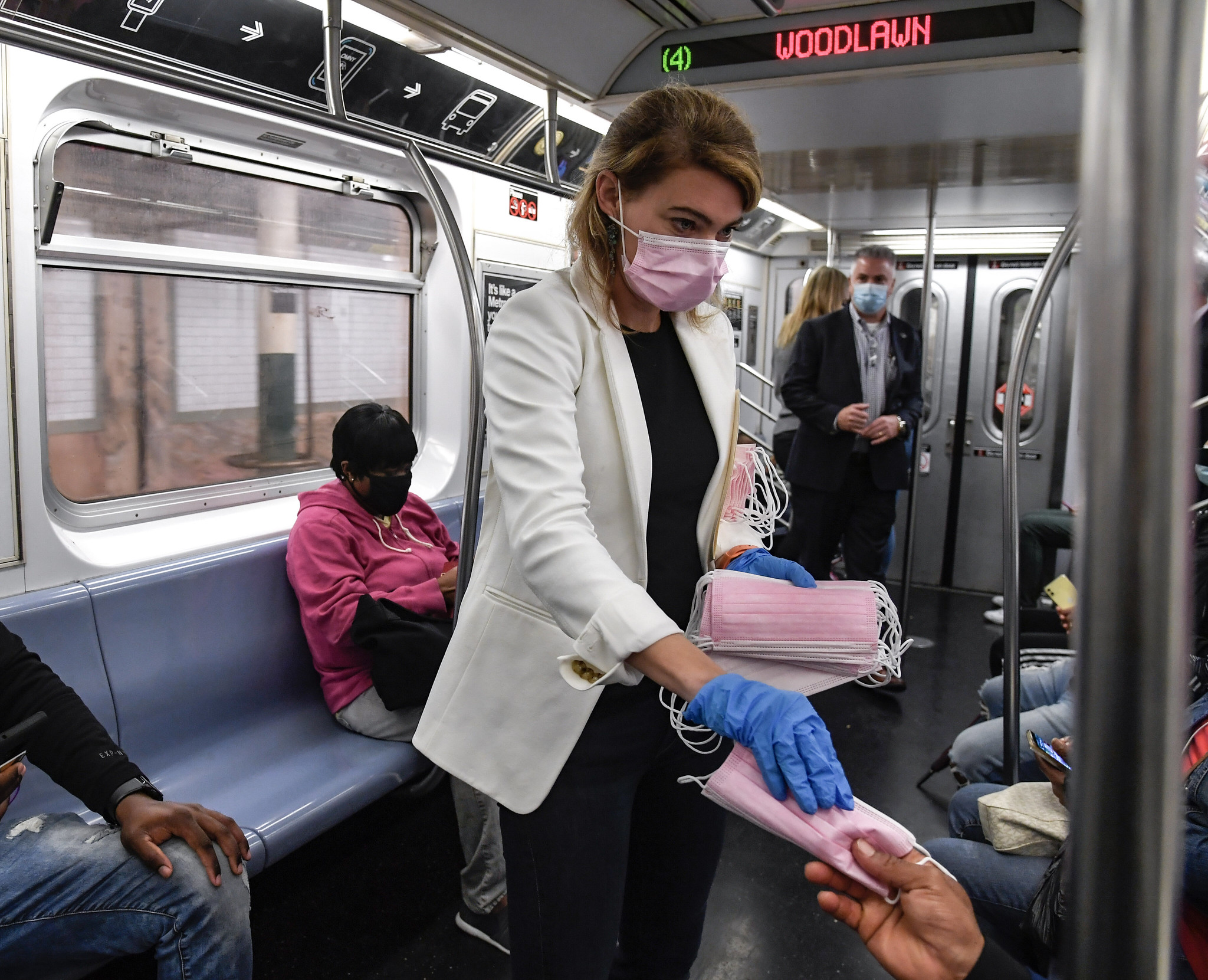 nyc transit interim president sarah feinberg hands out pink surgical masks as part of the mask force
