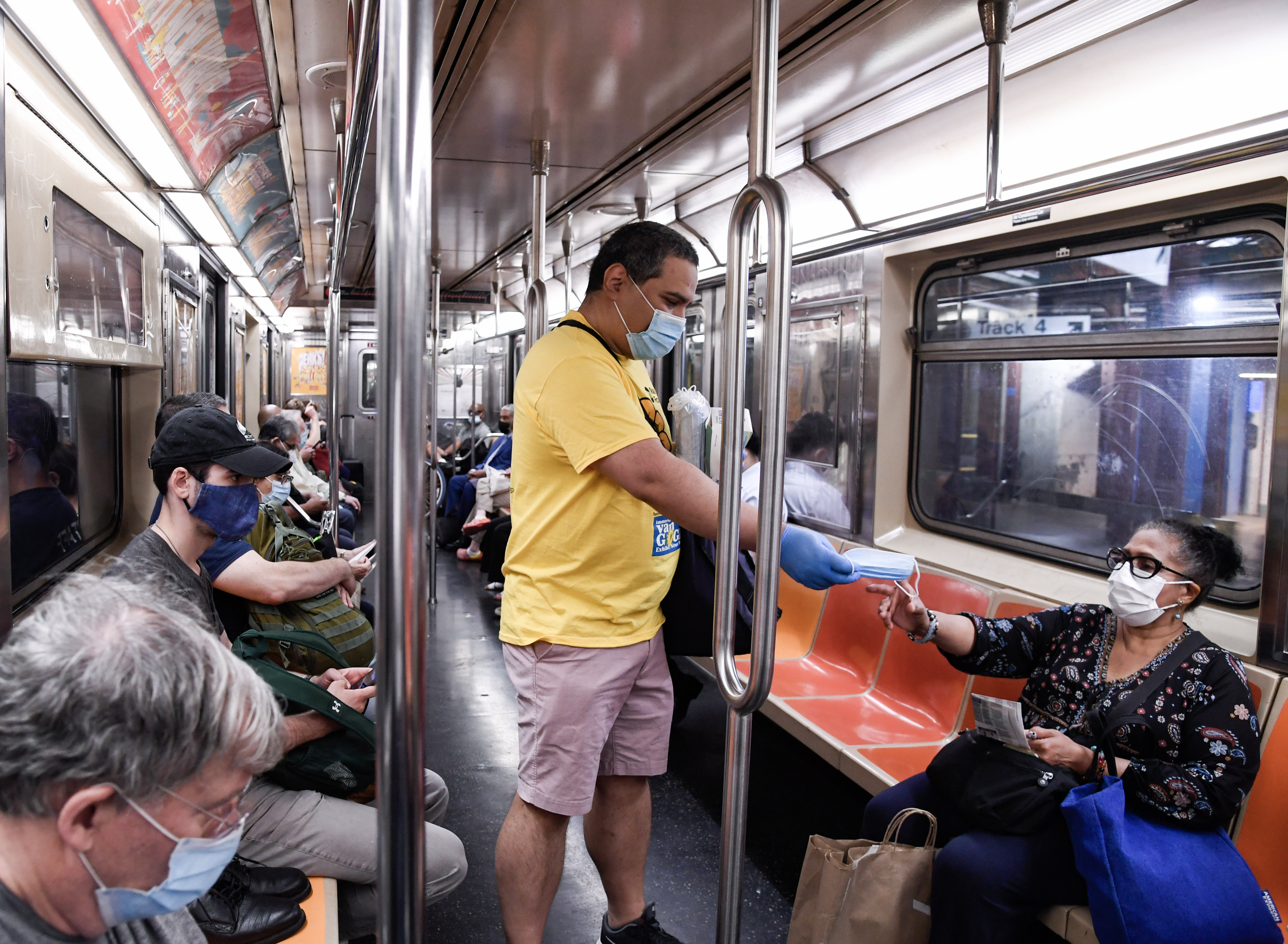 MTA Mask Force volunteers distribute free masks to subway customers 