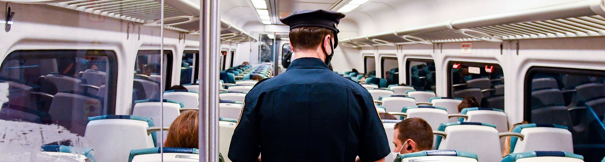 A police officer on a train.