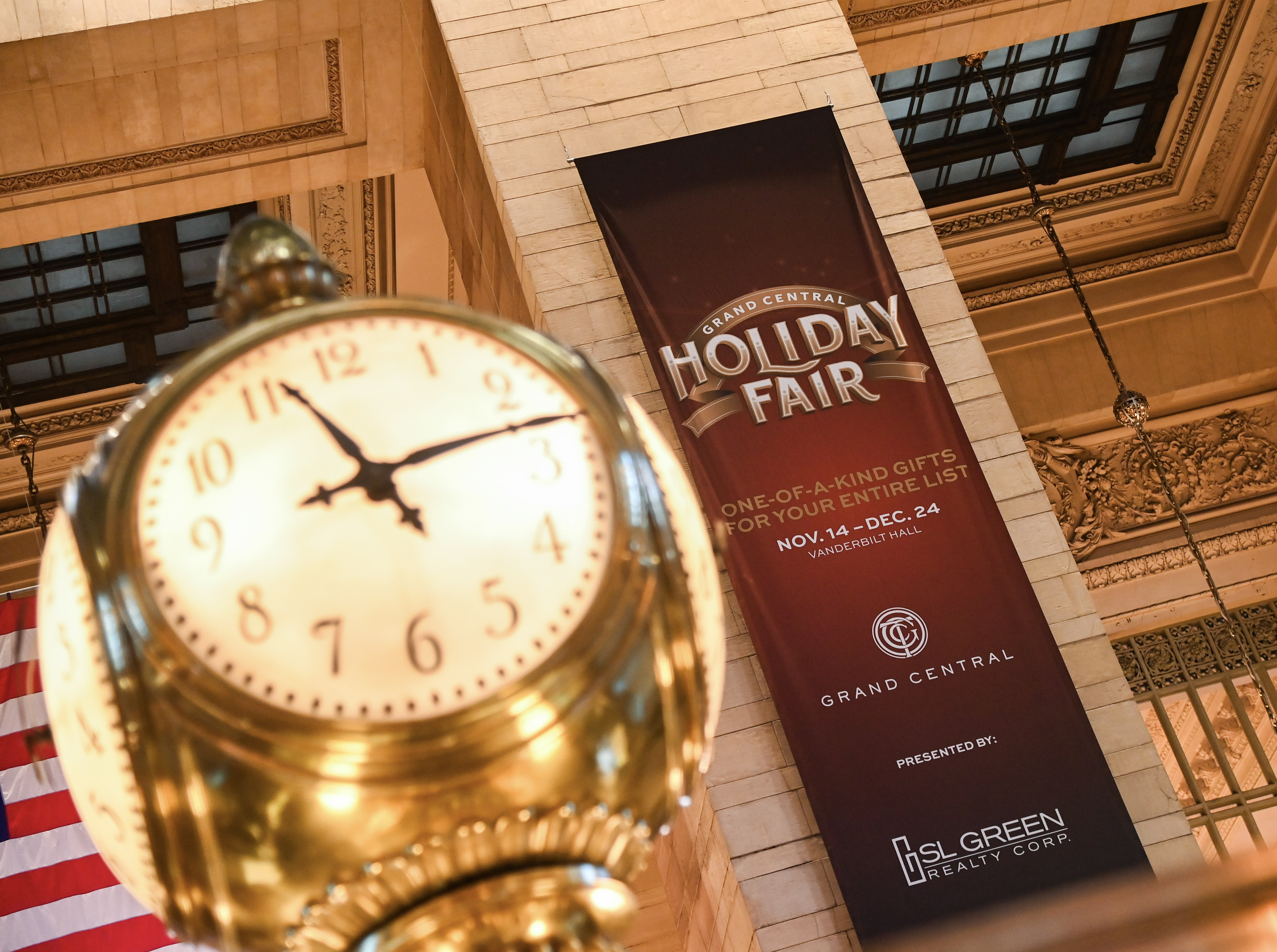 picture of the GCT clock with banner of Holiday Fair in the background