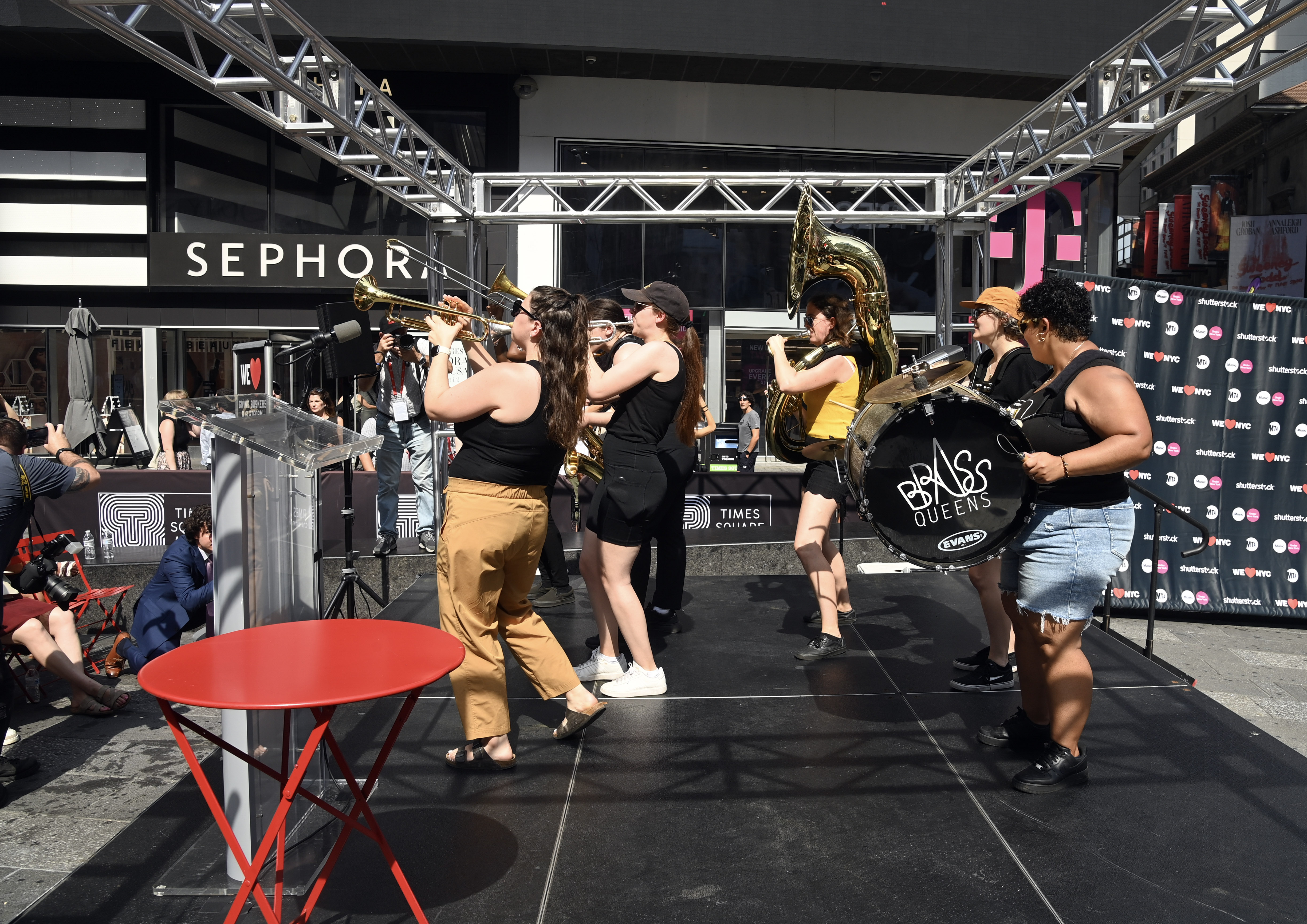 all female band called the Brass Queens perform on stage at Times Square 