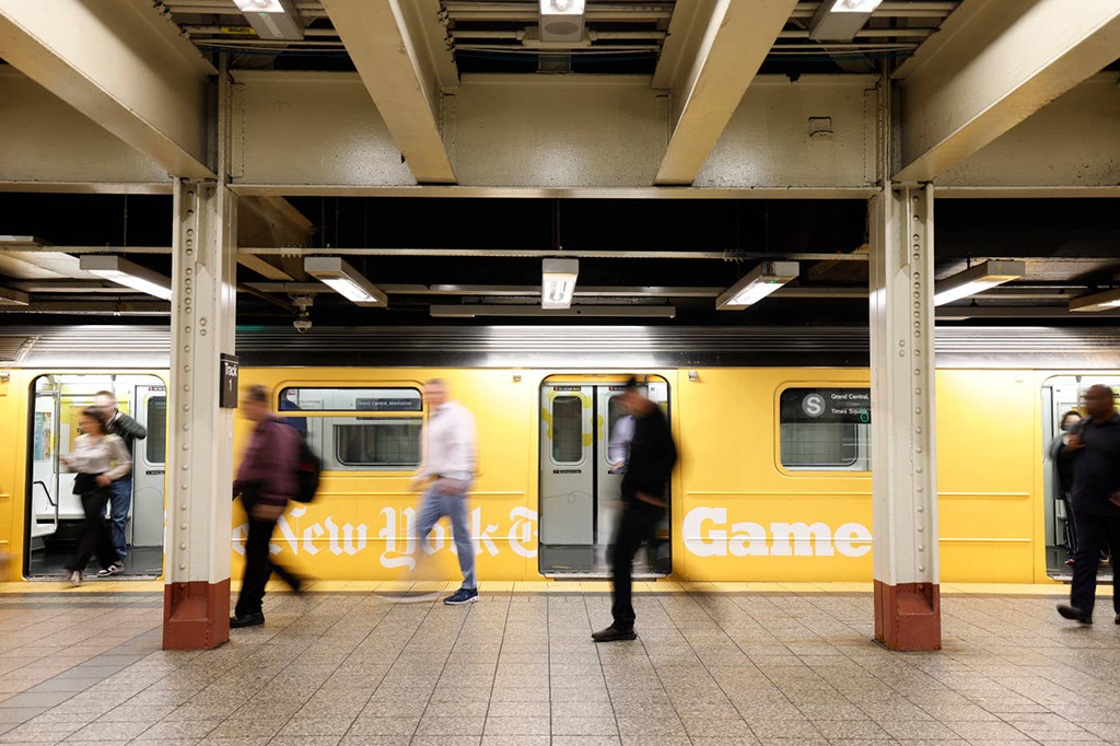 A subway train car wrapped with the NY Times Games ad