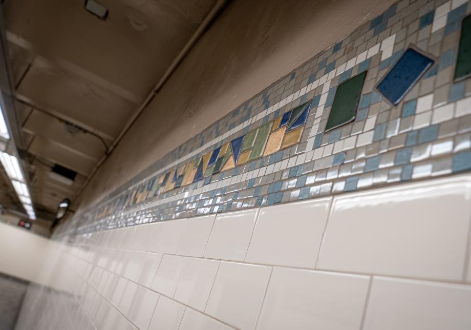 Photo of the restored tile work at the 168 St 1 station