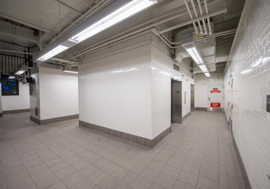 Photo of the new elevators and retiled station walls at the 191 St 1 station